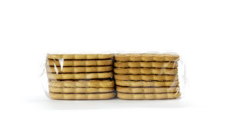 Cookies in transparent packaging. Close up. Isolated on white background.の写真素材