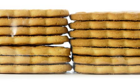 Two stacks of cookies. Close up. Isolated on white background.