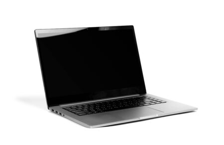Laptop in a metal case with a black blank screen. The laptop on the table. Close up. Isolated on white background.の写真素材