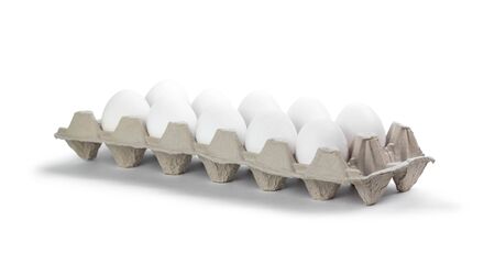 A dozen white eggs. Close up. Isolated on white background.