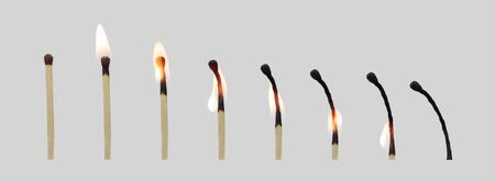 The match at different stages of combustion. Close up. Isolated on a grey background.の写真素材