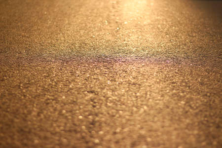 The asphalt at sunset. Orange asphaltの写真素材