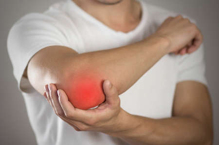 Sore throat in a man. Highlighted in red. On a gray background. Close up.