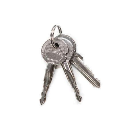 A bunch of three keys. Close up. Isolated on a white background.の写真素材