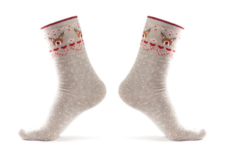Christmas socks on the foot. Close up. Isolated on a white background.の写真素材