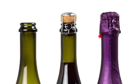 The neck of a champagne bottle. Sealed, closed, open. Close up. On a white background.の写真素材