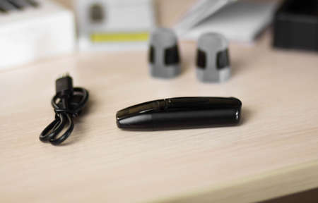 Black electronic cigarette. Electronic nicotine delivery system.
