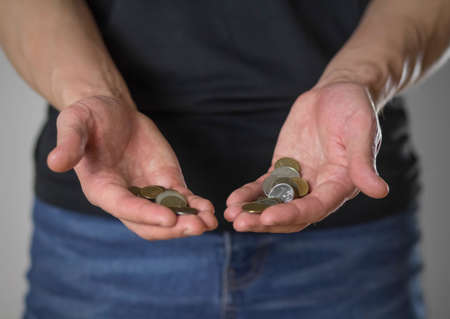 Man showing hands with money. Bankruptcy financial crisis and poverty concept. close up.