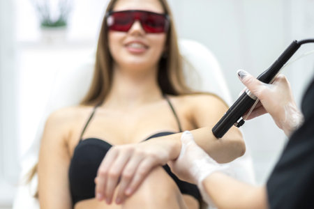 A girl at laser hair removal treatments.の写真素材