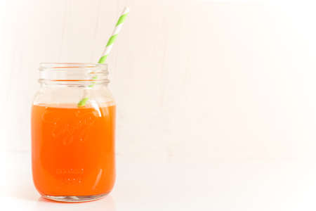 orange on white background Half an orange and orange juice.の写真素材