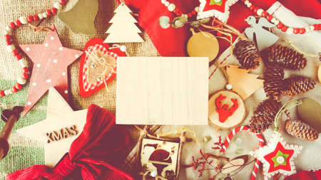 Christmas decorations for the tree. in red, green, yellow, white and wood colors. Cozy photos. Space to write text. wallpaper and support cropping.の写真素材