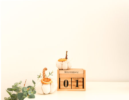 Calendar with date November 1. Fabric pumpkins next to the date November 1 on a white background. All Saints Day. Public holiday.の写真素材
