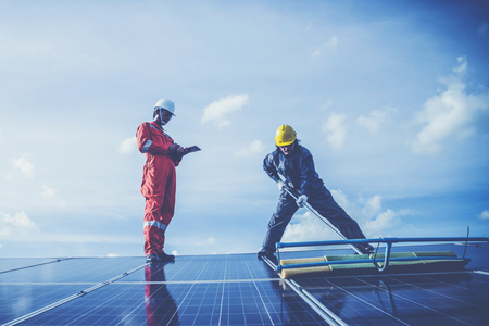 operation and maintenance in solar power plant ; engineer working on checking and maintenance in solar power plant ,solar power plant to innovation of green energy for lifeの写真素材