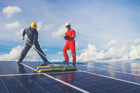 operation and maintenance in solar power plant ; engineer working on checking and maintenance in solar power plant ,solar power plant to innovation of green energy for lifeの写真素材