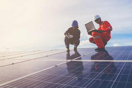 operation and maintenance in solar power plant ; engineer working on checking and maintenance in solar power plant ,solar power plant to innovation of green energy for lifeの写真素材