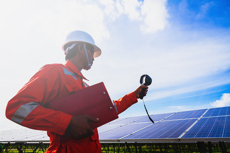 operation and maintenance in solar power plant ; engineer working on checking and maintenance in solar power plant ,solar power plant to innovation of green energy for lifeの写真素材