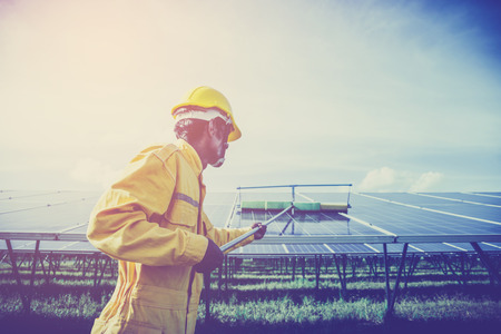 operation and maintenance in solar power plant ; engineer working on checking and maintenance in solar power plant ,solar power plant to innovation of green energy for lifeの写真素材