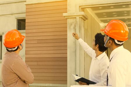 business teamwork discussing ideas and planning for business negotiation at construction siteの写真素材