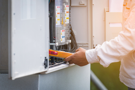 an engineer working on checking and maintenance equipment in solar power plantの写真素材