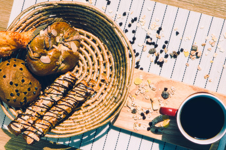 Top view of healthy eating and traditional bakery concept; fresh bread on the kitchen table with...