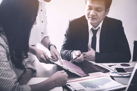 business partners signing contract to borrow money from investor to invest at own business