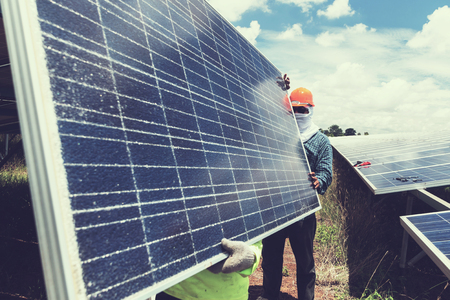 engineer team working on replacement solar panel in solar power plant;engineer and electrician team...