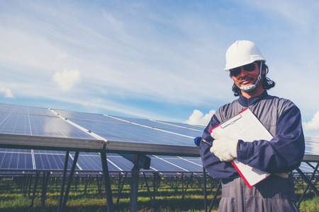 engineers operating and check generating power of solar power plant on solar rooftop; technical team...