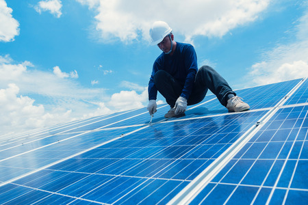 engineer team working on replacement solar panel in solar power plant;engineer and electrician team swapping and install solar panel ; electrician team checking hot spot on break panelの写真素材
