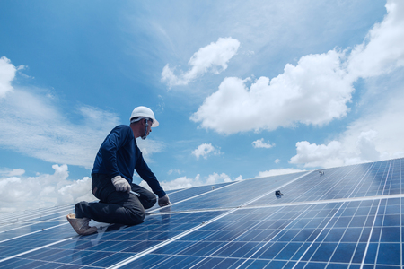 engineer team working on replacement solar panel in solar power plant;engineer and electrician team swapping and install solar panel ; electrician team checking hot spot on break panelの写真素材