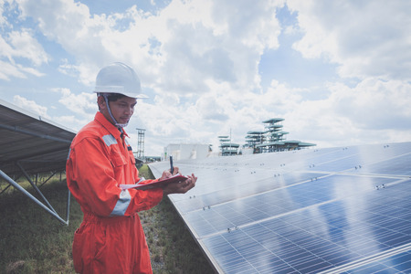 operation and maintenance in solar power plant ; engineering team working on checking and maintenance in solar power plant ,solar power plant to innovation of green energy for lifeの写真素材