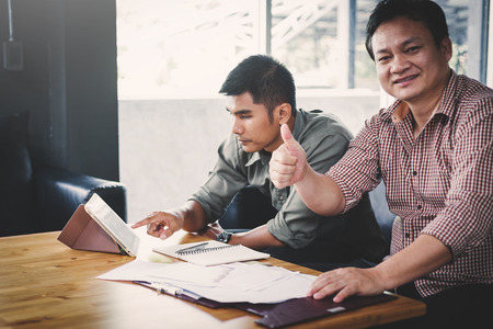 businessteam discussing ideas and planning about profits summaryの写真素材