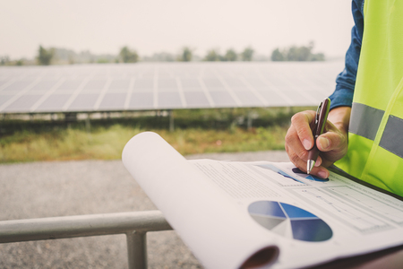 engineer or electrician inspect and checking solar equipment ;smart technology for operation of solar power plant by smart operatorの写真素材