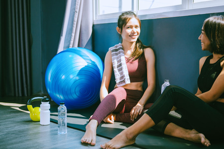 workout concept; young woman feeling relax in yoga class
