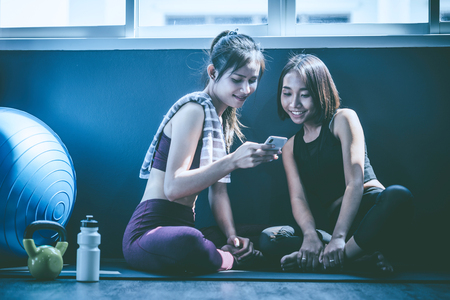 workout concept; young woman feeling relax in yoga classの写真素材