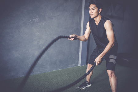 workout concept; young people practicing workout in class