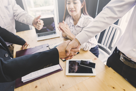 concept of partner succession of contract business ; business handshaking process after successful deal of meeting with partnerの写真素材