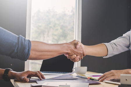 Business negotiation concept; Business people handshaking to sign contract of businessの写真素材