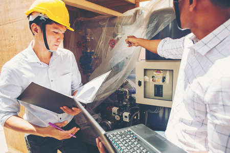 Project engineer, engineer working on blueprint architectural project at construction site