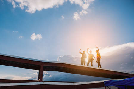 Project engineer, engineer working on blueprint architectural project at construction siteの写真素材