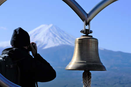 Man taking a photo of Fuji mountain