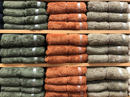colorful winter clothes on the shelf for sale in the shopping mall
