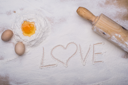baking ingredients eggs, flour, sugar, butter, yeast. dough preparation. food backgroundの写真素材