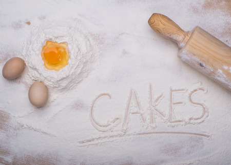 baking ingredients eggs, flour, sugar, butter, yeast. dough preparation. food backgroundの写真素材