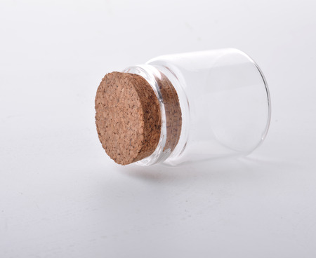 Empty little bottles with cork stopper isolated on whiteの写真素材