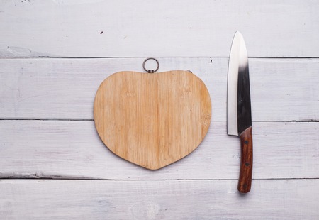 Heart shape of chopped celery and fresh vegetables, on wooden backgroundの写真素材