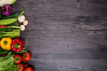 studio photography of different fruits and vegetables on old wooden tableの写真素材