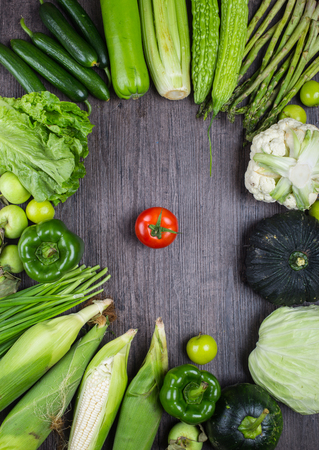 studio photography of different fruits and vegetables on old wooden tableの写真素材