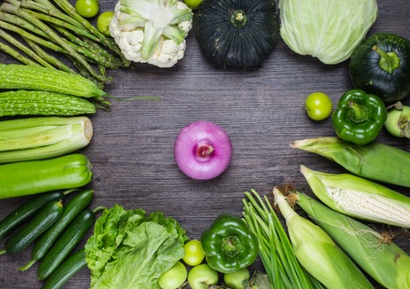studio photography of different fruits and vegetables on old wooden tableの写真素材