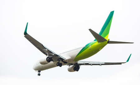 Place flying in sunset skyのeditorial素材