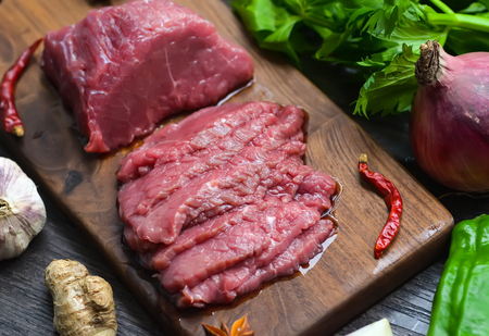 Raw beef meat on a cutting boardの写真素材